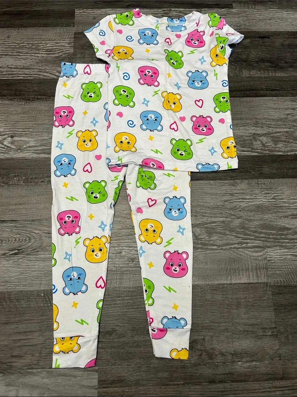 Care Bears White Pajama Set with Pink, Blue, Green, and Yellow Bears